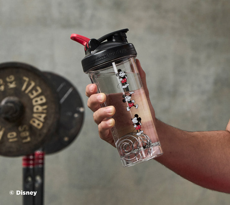pro-series-f7 Mickey_Mouse_Protein_Shaker_Bottle_Being_Held_In_the_Gym.jpg